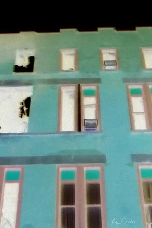 Постер: Brick Building with Red and Green Windows
